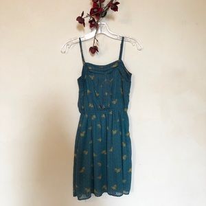 Green and gold flowered dress